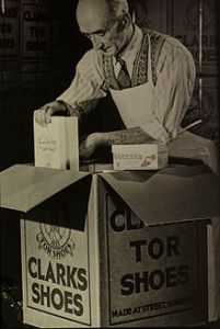 Clarks_vintage_photograph_-_man_packing_Clarks_Tor_Shoes